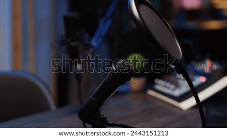 Zoom out shot of podcast microphone used to record conversations with impeccable sound quality for internet show. Close up shot of audio capturing and recording technology