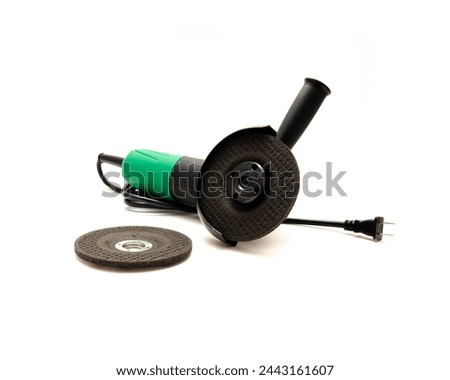 Top view corded angle grinder with aluminum oxide general purpose griding wheels, manufactured heat treated grit grains in high concentrations cutting steel, metals, stone, isolated background. White Royalty-Free Stock Photo #2443161607