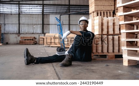 Multiracial engineer, worker sitting resting on floor feel tired from overworked in factory. Young adult technician feel weak, stress, exhausted, worried, frustrated, unhappy, hopeless, or headache Royalty-Free Stock Photo #2443190449