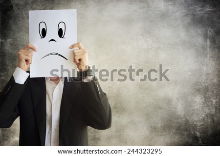 Businessman holding paper with face expression