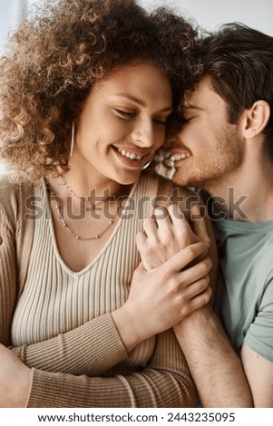 Romantic image of loving couple embracing warmly in the morning light, laughing and hugging