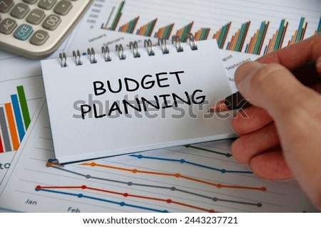 Budget planning text on notepad with business analysis background Royalty-Free Stock Photo #2443237721