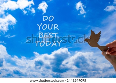 Do your best today symbol. Concept words Do your best today. Beautiful blue sky cloud background. Voter hand with wooden bird. Business motivational do your best today concept. Copy space.