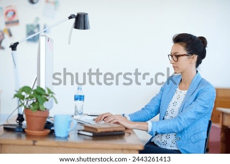Business woman, typing and planning on computer for creative project, research and online editing or copywriting. Young professional editor, writer or person on desktop for job or startup newsletter