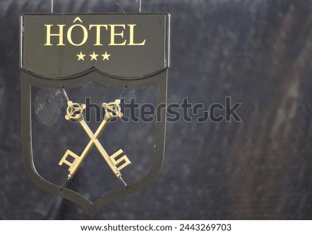Three star Hotel sign in Turckheim Alsace, France.