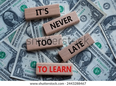 It is Never to Late to Learn symbol. Wooden blocks with words It is Never to Late to Learn. Beautiful dollar background. Business and It is Never to Late to Learn. Copy space.