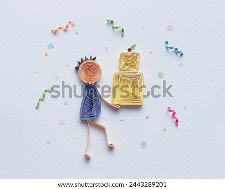 quilled stick figure man giving a cake. Happy birthday. Surprise. Celebrating Holiday or Important Event. greeting cards. Hand made of paper quilling technique. Handicraft at home. Hobby, home office