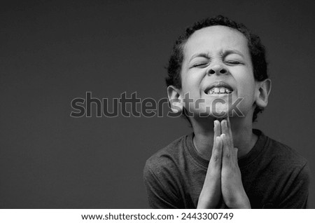 little boy praying to god wit people stock image stock photo	