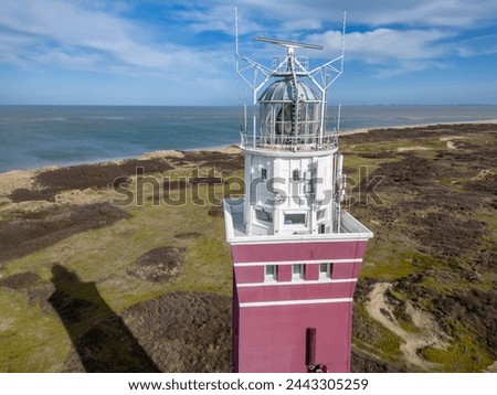 Vuurtoren lighthouse in the 
dutch coasts (Nederland) from drone view