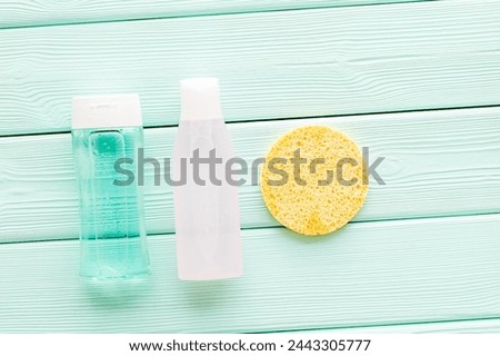 Skin care. Organic cosmetics for face clearing with sponge, facial tonic and mycelial water on mint green background top view mockup Royalty-Free Stock Photo #2443305777