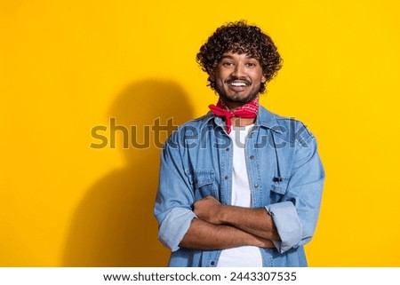 Photo portrait of nice young male folded hands professional dressed stylish denim outfit red scarf isolated on yellow color background