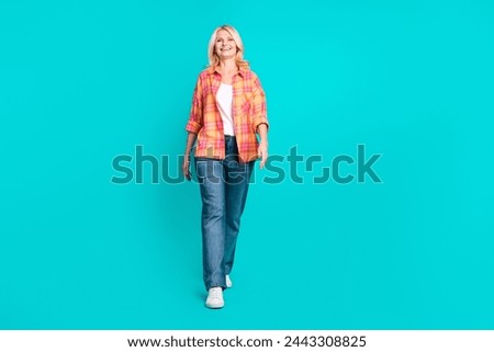 Full size photo of optimistic pleasant pensioner person dressed checkered shirt jeans go shopping isolated on teal color background