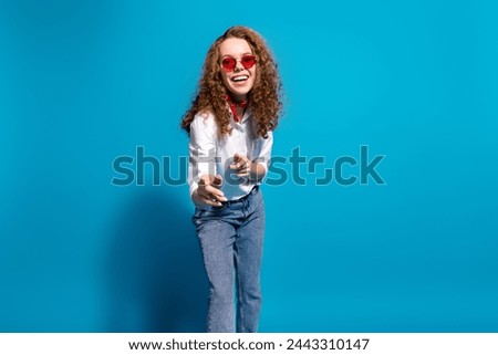 Photo portrait of nice young lady have fun point you sunglass summer vacation wear trendy white garment isolated on blue color background