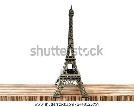 Eiffel Tower decoration on a white background. The Eiffel Tower is a tower in Paris, France.