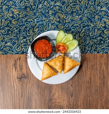Arab sambosa food photo taken in flat lay on a dining table with interesting line patterns