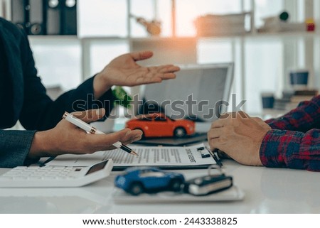 Car insurance or rental agreement or purchase or sale agreement with car keys on table Automotive business Car dealer, making deals and signing, close-up photo