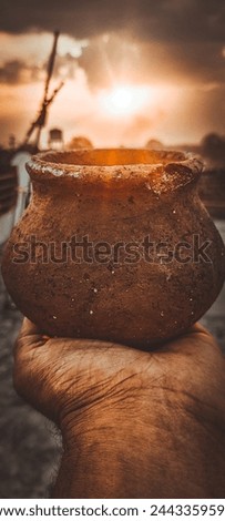It's a clay pot photo with beautiful evening sunset 