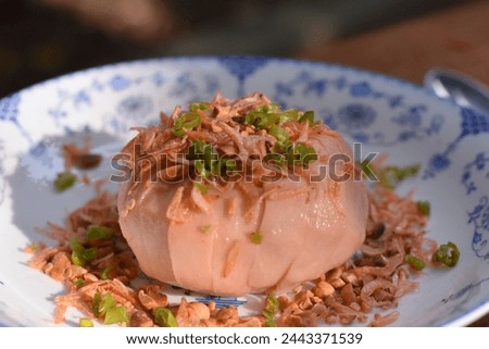 Thai dessert - Santol (Krathon) salad on top with chili, shrimp, peanut and no Thai sweet sauce - Santol at the center of picture 