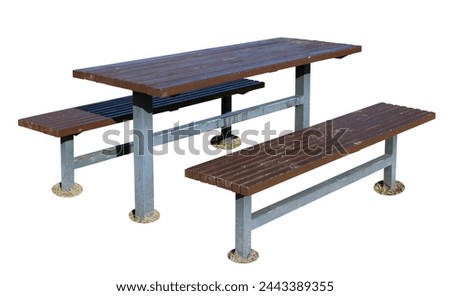 Shabby table and benches for barbecue in a public park. Isolated on white