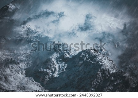 View of snowcapped mountains against blue sky Royalty-Free Stock Photo #2443392327