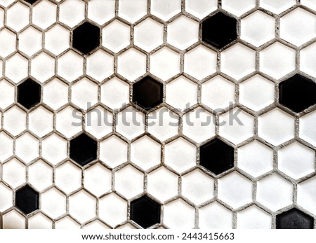 hexagon motif black  White.  abstract hexagon for background. wall background. background texture. wall with textured hexagons. the diamonds on the wall. white wall