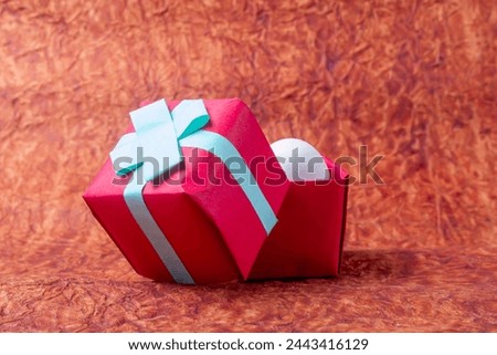 Gift boxes and white easter eggs on a background of brown paper. Happy Easter concept.