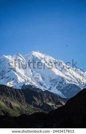 picture taken from aliabad hunza, this mountain name is Rakaposhi.