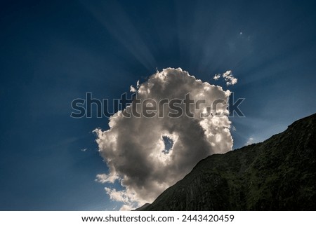 The cloud with the hall wit sun beams