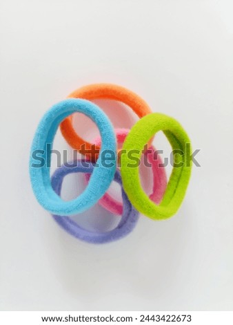 colorful hair ties on a white background