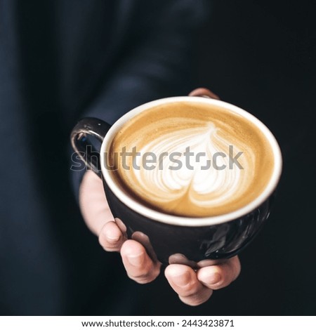 Coffee cup picture. Fresh coffee cup in hand image. This is a coffee cup image. This is looking good image for use in your different projects. 