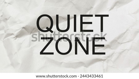 Cement wall with a white note written QUIET ZONE, to control noise and improve privacy to focus on studies like workplace library, hospital or meditation place or area where mobile phones are banned