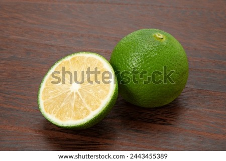 Japanese citrus hebes on the table Royalty-Free Stock Photo #2443455389