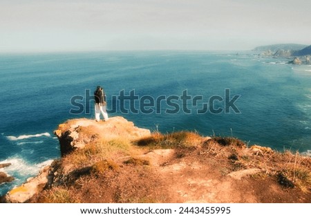 landscape photographer, standing, taking photos, Loiba cliffs, Ortega, Galicia, Spain,