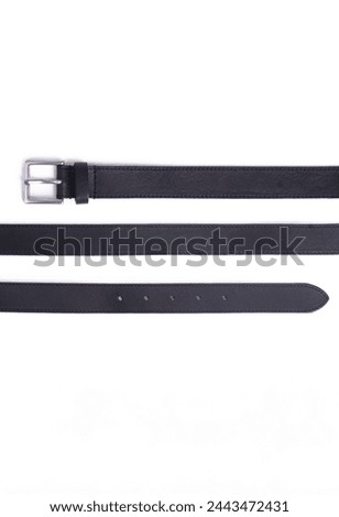 black belt on a white background. Royalty-Free Stock Photo #2443472431