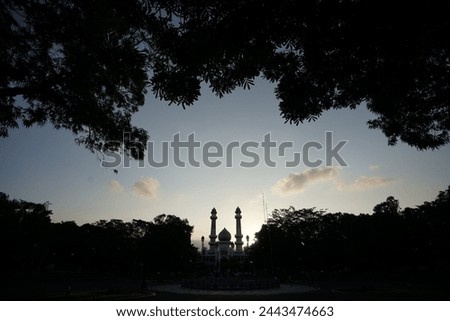 beautiful silhouette of the grand mosque with the sky in the afternoon