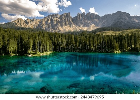 Carezza Lake. Beautifull blue lake in the Dolomites of Trentino Alto Adige, Nova Levante. Paradise landscape at Karersee with mountain Latemar. Italy. Royalty-Free Stock Photo #2443479095