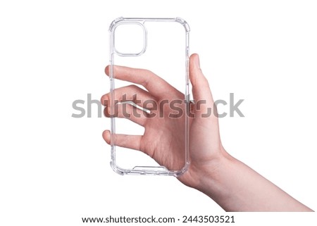 Clear iPhone 15 Plus case isolated on white background. Silicone case in a female hand. Phone case mock up. Holding phone cover in hand