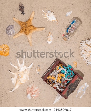 Copyspace. Money for vacation, rest, holidays. A well-deserved vacation at an expensive seaside resort. Jewelry in the chest on the sand of beach. Royalty-Free Stock Photo #2443509817