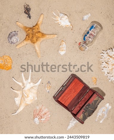 Copyspace. Money for vacation, rest, holidays. A well-deserved vacation at an expensive seaside resort. Open chest on the sand of beach. Royalty-Free Stock Photo #2443509819
