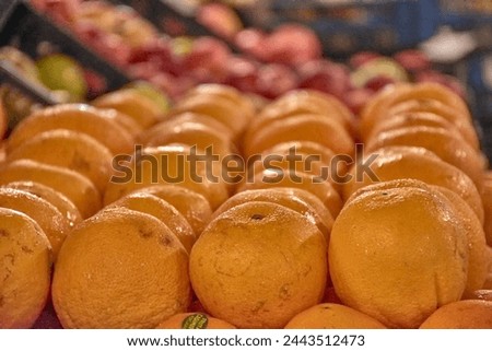 Closeup of oranges on a vegetable stall at the Graca market in Ponta Delgada, Azores, Portugal