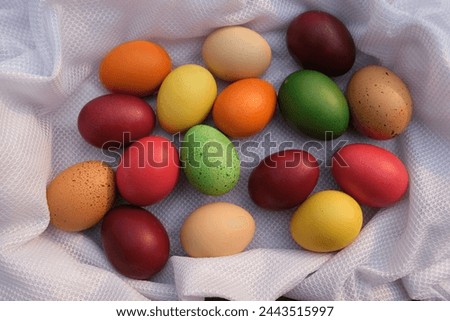 Colorful easter eggs Against a white background, horizontal top view.