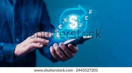 Businessman is holding a cell phone and touching a screen that shows a dollar sign and other currencies, Concept of currency exchange, banking, transfer, payment and financial