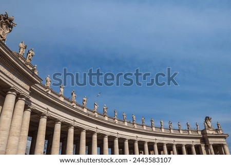Rome, St. Peter's Square, colonnades of 284 columns and 88 pillars supporting a continuous architrave, crowned by 96 marble statues, designed by Bernini. Royalty-Free Stock Photo #2443583107