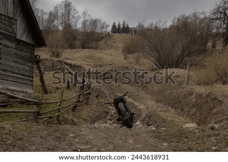 Yasinya, Ukraine. March 17, 2024, early spring, cloudy rainy sky. an incredibly beautiful view of the fog-shrouded mountains. small village houses in which people live. cozy village in the mountains.
