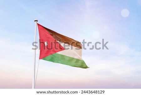 Jordan flag with mast at amazing sunlight.