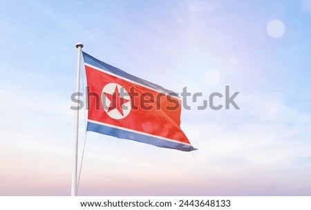 North Korea flag with mast at amazing sunlight.