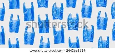 Top view pattern from blue plastic bags, wide banner. Single-use empty polythene packet, Eco trend to reduce disposable plastics, Biodegradable packaging waste, trendy photo pattern, design background
