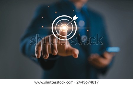 Businessman holding target icon Business Growth and Vision, target Plans and Business Strategies and Competitive Advantage, Banking and Finance, Goal Achievement The path to success. Royalty-Free Stock Photo #2443674817