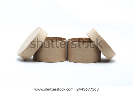 Round craft cardboard box for product on white background