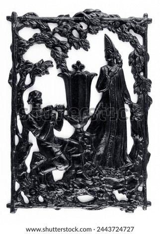 Purchased (consumer) slotted bas-relief of the fairy tale "Mistress of the Copper Mountain" made of cast iron close-up on a white background